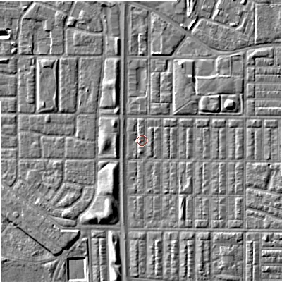Shaded relief map of the ground around M144RW, computed from Environment Agency LiDAR. The ground here sits at about 33 m above sea level and falls 5 m across the surrounding 800 m. Surface water reaching this point runs off ground lying to the east-north-east, 3.7 m higher.