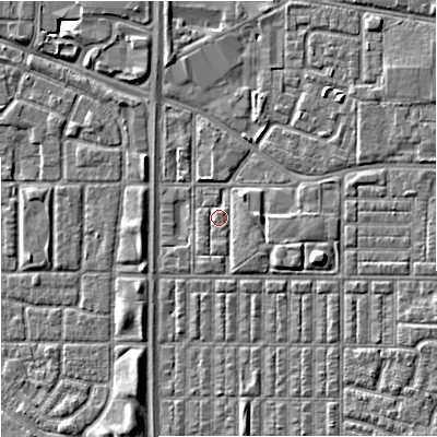 Shaded relief map of the ground around M144SW, computed from Environment Agency LiDAR. The ground here sits at about 33 m above sea level and falls 6 m across the surrounding 800 m. Surface water reaching this point runs off ground lying to the east-south-east, 2.4 m higher.