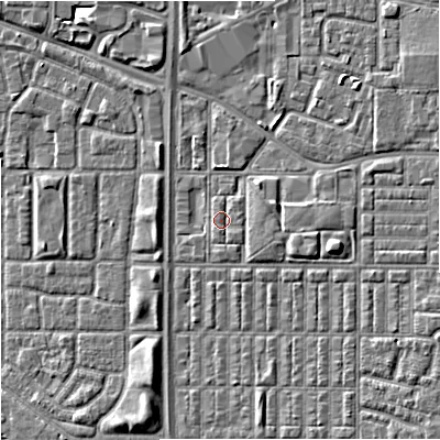 Shaded relief map of the ground around M144SX, computed from Environment Agency LiDAR. The ground here sits at about 33 m above sea level and falls 6 m across the surrounding 800 m. Surface water reaching this point runs off ground lying to the south, 0.7 m higher.