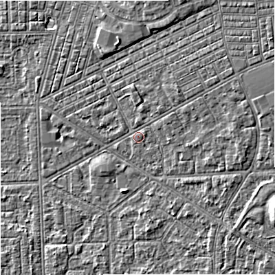 Shaded relief map of the ground around M147BU, computed from Environment Agency LiDAR. The ground here sits at about 33 m above sea level and falls 7 m across the surrounding 800 m. Surface water reaching this point runs off ground lying to the north-east, 3.4 m higher.