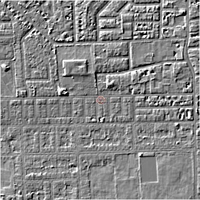 Shaded relief map of the ground around M168JE, computed from Environment Agency LiDAR. The ground here sits at about 29 m above sea level and falls 5 m across the surrounding 800 m. Surface water reaching this point runs off ground lying to the north-east, 2.1 m higher.
