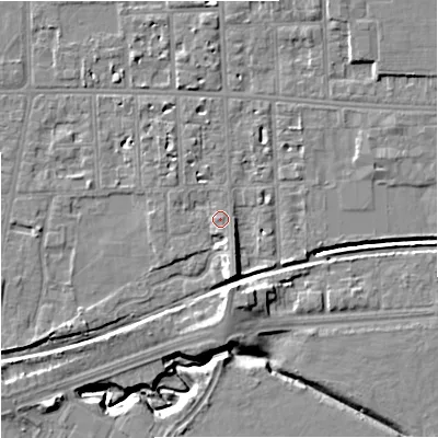 Shaded relief map of the ground around M168NU, computed from Environment Agency LiDAR. The ground here sits at about 32 m above sea level and falls 11 m across the surrounding 800 m. Surface water reaching this point runs off ground lying to the south-south-east, 2.7 m higher.