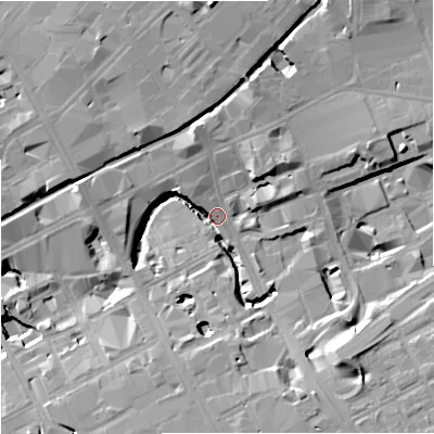 Shaded relief map of the ground around M16NG, computed from Environment Agency LiDAR. The ground here sits at about 33 m above sea level and falls 20 m across the surrounding 800 m. Surface water reaching this point runs off ground lying to the north-north-east, 16.8 m higher.