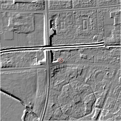 Shaded relief map of the ground around M201BE, computed from Environment Agency LiDAR. The ground here sits at about 33 m above sea level and falls 9 m across the surrounding 800 m. Surface water reaching this point runs off ground lying to the north-west, 5.6 m higher.