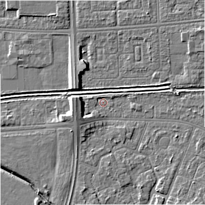 Shaded relief map of the ground around M201GY, computed from Environment Agency LiDAR. The ground here sits at about 31 m above sea level and falls 9 m across the surrounding 800 m. Surface water reaching this point runs off ground lying to the west, 5.8 m higher.