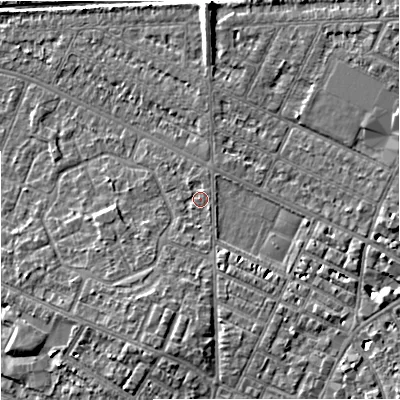 Shaded relief map of the ground around M203FG, computed from Environment Agency LiDAR. The ground here sits at about 34 m above sea level and falls 6 m across the surrounding 800 m. Surface water reaching this point runs off ground lying to the south, 1.3 m higher.