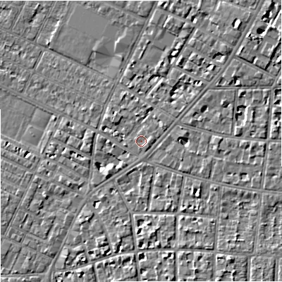 Shaded relief map of the ground around M203NB, computed from Environment Agency LiDAR. The ground here sits at about 35 m above sea level and falls 7 m across the surrounding 800 m. Surface water reaching this point runs off ground lying to the east-north-east, 1.1 m higher.
