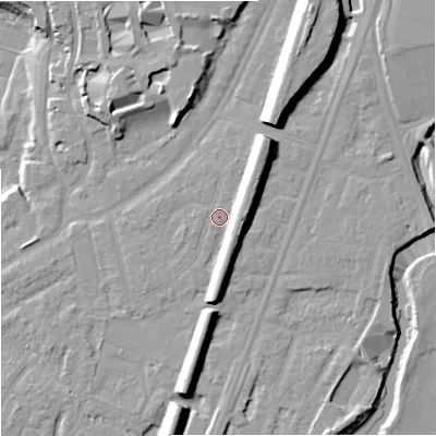 Shaded relief map of the ground around M205WE, computed from Environment Agency LiDAR. The ground here sits at about 35 m above sea level and falls 16 m across the surrounding 800 m. Surface water reaching this point runs off ground lying to the east-north-east, 6.5 m higher.
