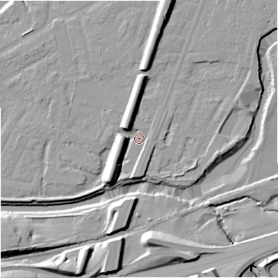 Shaded relief map of the ground around M205WR, computed from Environment Agency LiDAR. The ground here sits at about 33 m above sea level and falls 17 m across the surrounding 800 m. Surface water reaching this point runs off ground lying to the south-west, 9.2 m higher.