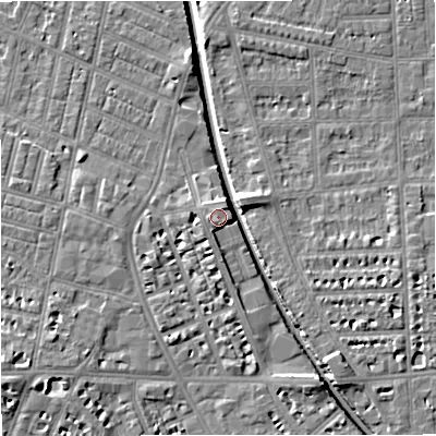 Shaded relief map of the ground around M210AW, computed from Environment Agency LiDAR. The ground here sits at about 30 m above sea level and falls 7 m across the surrounding 800 m. Surface water reaching this point runs off ground lying to the north-east, 2.1 m higher.