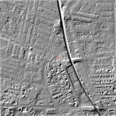 Shaded relief map of the ground around M210BN, computed from Environment Agency LiDAR. The ground here sits at about 27 m above sea level and falls 7 m across the surrounding 800 m. Surface water reaching this point runs off ground lying to the south-east, 1.4 m higher.