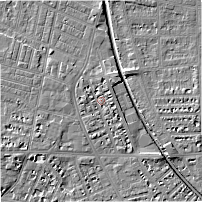 Shaded relief map of the ground around M210BW, computed from Environment Agency LiDAR. The ground here sits at about 28 m above sea level and falls 7 m across the surrounding 800 m. Surface water reaching this point runs off ground lying to the south-south-west, 2.6 m higher.
