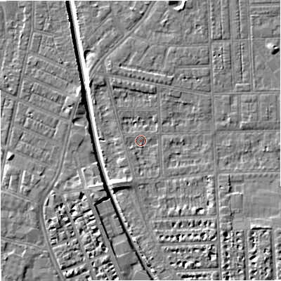 Shaded relief map of the ground around M210RE, computed from Environment Agency LiDAR. The ground here sits at about 28 m above sea level and falls 7 m across the surrounding 800 m. Surface water reaching this point runs off ground lying to the south-south-west, 3.6 m higher.