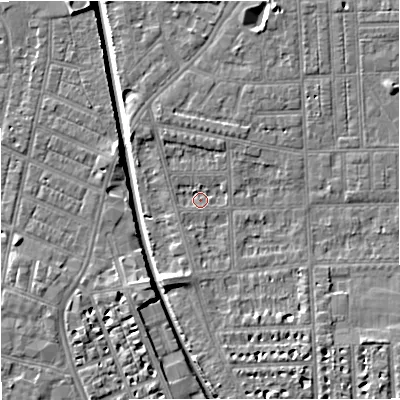 Shaded relief map of the ground around M210RF, computed from Environment Agency LiDAR. The ground here sits at about 28 m above sea level and falls 7 m across the surrounding 800 m. Surface water reaching this point runs off ground lying to the south-south-west, 3.8 m higher.