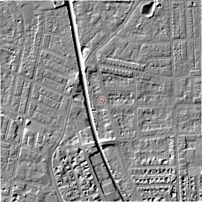 Shaded relief map of the ground around M210RG, computed from Environment Agency LiDAR. The ground here sits at about 27 m above sea level and falls 7 m across the surrounding 800 m. Surface water reaching this point runs off ground lying to the north, 1.6 m higher.