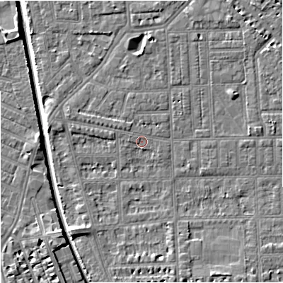 Shaded relief map of the ground around M210RL, computed from Environment Agency LiDAR. The ground here sits at about 28 m above sea level and falls 7 m across the surrounding 800 m. Surface water reaching this point runs off ground lying to the north-west, 0.9 m higher.