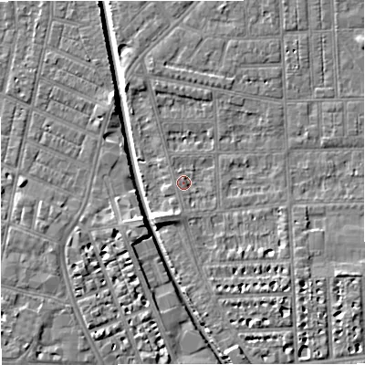 Shaded relief map of the ground around M210RR, computed from Environment Agency LiDAR. The ground here sits at about 28 m above sea level and falls 7 m across the surrounding 800 m. Surface water reaching this point runs off ground lying to the south-west, 3.6 m higher.