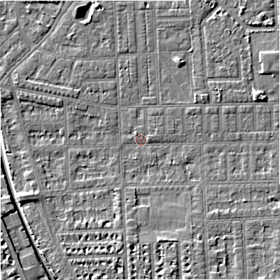 Shaded relief map of the ground around M210RU, computed from Environment Agency LiDAR. The ground here sits at about 28 m above sea level and falls 7 m across the surrounding 800 m. Surface water reaching this point runs off ground lying to the east-north-east, 4.1 m higher.