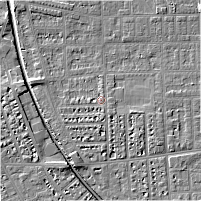 Shaded relief map of the ground around M210SN, computed from Environment Agency LiDAR. The ground here sits at about 29 m above sea level and falls 7 m across the surrounding 800 m. Surface water reaching this point runs off ground lying to the south-south-east, 1.8 m higher.