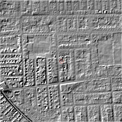 Shaded relief map of the ground around M210TL, computed from Environment Agency LiDAR. The ground here sits at about 29 m above sea level and falls 6 m across the surrounding 800 m. Surface water reaching this point runs off ground lying to the south-south-east, 2.4 m higher.