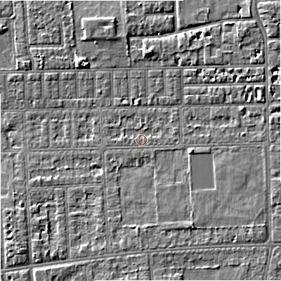 Shaded relief map of the ground around M210TS, computed from Environment Agency LiDAR. The ground here sits at about 29 m above sea level and falls 5 m across the surrounding 800 m. Surface water reaching this point runs off ground lying to the east-north-east, 1.0 m higher.