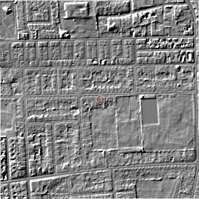 Shaded relief map of the ground around M210TT, computed from Environment Agency LiDAR. The ground here sits at about 29 m above sea level and falls 4 m across the surrounding 800 m. Surface water reaching this point runs off ground lying to the south-east, 2.2 m higher.