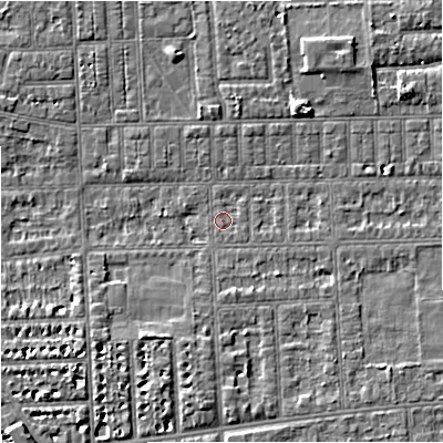 Shaded relief map of the ground around M210TW, computed from Environment Agency LiDAR. The ground here sits at about 28 m above sea level and falls 6 m across the surrounding 800 m. Surface water reaching this point runs off ground lying to the south-east, 2.4 m higher.