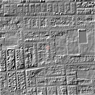 Shaded relief map of the ground around M210UG, computed from Environment Agency LiDAR. The ground here sits at about 29 m above sea level and falls 4 m across the surrounding 800 m. Surface water reaching this point runs off ground lying to the south-south-east, 1.0 m higher.