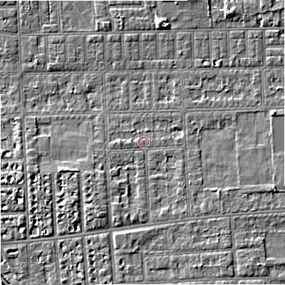 Shaded relief map of the ground around M210UQ, computed from Environment Agency LiDAR. The ground here sits at about 29 m above sea level and falls 6 m across the surrounding 800 m. Surface water reaching this point runs off ground lying to the south-south-west, 2.6 m higher.