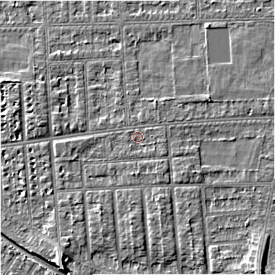 Shaded relief map of the ground around M210UZ, computed from Environment Agency LiDAR. The ground here sits at about 29 m above sea level and falls 7 m across the surrounding 800 m. Surface water reaching this point runs off ground lying to the east-south-east, 1.1 m higher.