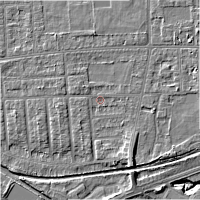 Shaded relief map of the ground around M210XY, computed from Environment Agency LiDAR. The ground here sits at about 29 m above sea level and falls 9 m across the surrounding 800 m. Surface water reaching this point runs off ground lying to the south-south-east, 4.5 m higher.