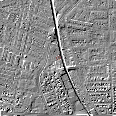 Shaded relief map of the ground around M211BN, computed from Environment Agency LiDAR. The ground here sits at about 27 m above sea level and falls 7 m across the surrounding 800 m. Surface water reaching this point runs off ground lying to the south-south-east, 5.2 m higher.
