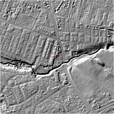 Shaded relief map of the ground around M218AU, computed from Environment Agency LiDAR. The ground here sits at about 27 m above sea level and falls 8 m across the surrounding 800 m. Surface water reaching this point runs off ground lying to the south-west, 2.3 m higher.
