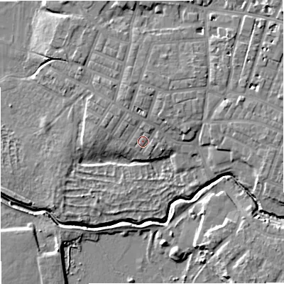 Shaded relief map of the ground around M219FS, computed from Environment Agency LiDAR. The ground here sits at about 26 m above sea level and falls 9 m across the surrounding 800 m. Surface water reaching this point runs off ground lying to the north-north-east, 2.4 m higher.