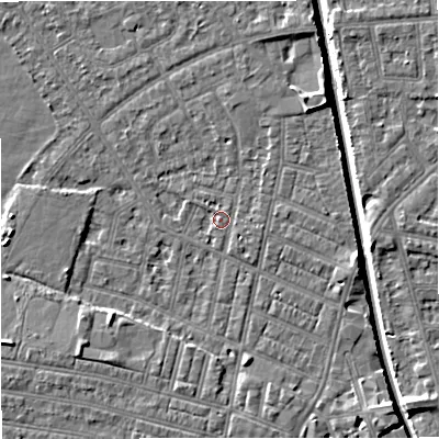 Shaded relief map of the ground around M219NX, computed from Environment Agency LiDAR. The ground here sits at about 28 m above sea level and falls 7 m across the surrounding 800 m. Surface water reaching this point runs off ground lying to the south-west, 3.7 m higher.