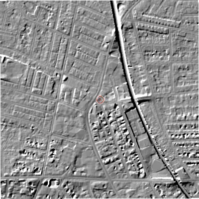 Shaded relief map of the ground around M219PQ, computed from Environment Agency LiDAR. The ground here sits at about 28 m above sea level and falls 7 m across the surrounding 800 m. Surface water reaching this point runs off ground lying to the south, 3.4 m higher.