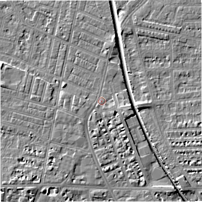 Shaded relief map of the ground around M219PT, computed from Environment Agency LiDAR. The ground here sits at about 27 m above sea level and falls 7 m across the surrounding 800 m. Surface water reaching this point runs off ground lying to the south, 3.4 m higher.