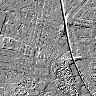 Shaded relief map of the ground around M219QE, computed from Environment Agency LiDAR. The ground here sits at about 27 m above sea level and falls 7 m across the surrounding 800 m. Surface water reaching this point runs off ground lying to the south-south-east, 3.4 m higher.