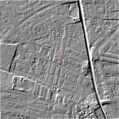Shaded relief map of the ground around M219QL, computed from Environment Agency LiDAR. The ground here sits at about 28 m above sea level and falls 7 m across the surrounding 800 m. Surface water reaching this point runs off ground lying to the north, 0.8 m higher.