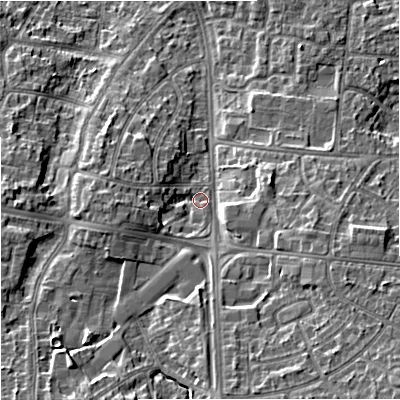 Shaded relief map of the ground around M228UD, computed from Environment Agency LiDAR. The ground here sits at about 47 m above sea level and falls 14 m across the surrounding 800 m. Surface water reaching this point runs off ground lying to the south, 7.1 m higher.