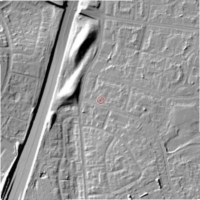 Shaded relief map of the ground around M229QB, computed from Environment Agency LiDAR. The ground here sits at about 52 m above sea level and falls 16 m across the surrounding 800 m. Surface water reaching this point runs off ground lying to the south-east, 3.1 m higher.