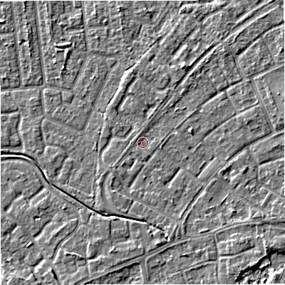 Shaded relief map of the ground around M230AZ, computed from Environment Agency LiDAR. The ground here sits at about 29 m above sea level and falls 5 m across the surrounding 800 m. Surface water reaching this point runs off ground lying to the south-east, 3.2 m higher.
