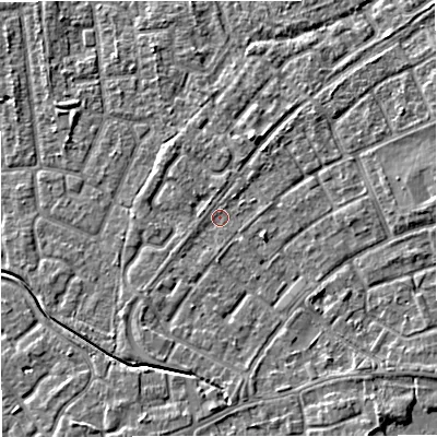Shaded relief map of the ground around M230ZH, computed from Environment Agency LiDAR. The ground here sits at about 29 m above sea level and falls 5 m across the surrounding 800 m. Surface water reaching this point runs off ground lying to the south-east, 3.2 m higher.