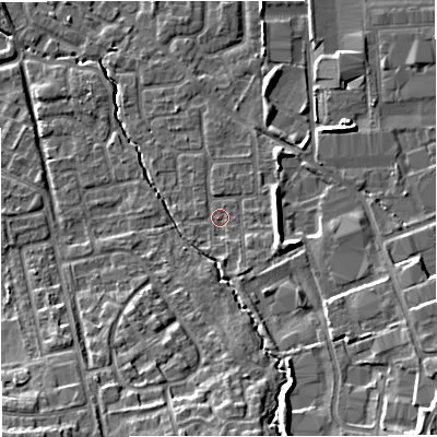 Shaded relief map of the ground around M239GU, computed from Environment Agency LiDAR. The ground here sits at about 33 m above sea level and falls 11 m across the surrounding 800 m. Surface water reaching this point runs off ground lying to the south-east, 7.7 m higher.
