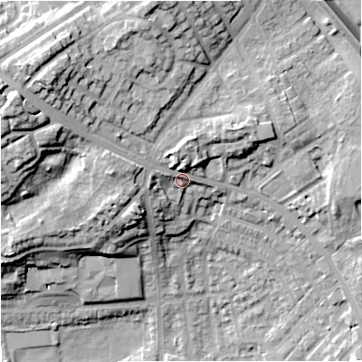 Shaded relief map of the ground around M251QP, computed from Environment Agency LiDAR. The ground here sits at about 101 m above sea level and falls 30 m across the surrounding 800 m. Surface water reaching this point runs off ground lying to the north-west, 14.6 m higher.