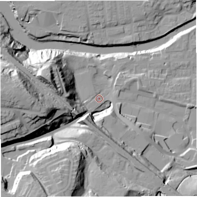 Shaded relief map of the ground around M261HE, computed from Environment Agency LiDAR. The ground here sits at about 53 m above sea level and falls 57 m across the surrounding 800 m. Surface water reaching this point runs off ground lying to the west, 46.6 m higher.
