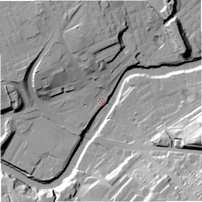 Shaded relief map of the ground around M261NN, computed from Environment Agency LiDAR. The ground here sits at about 64 m above sea level and falls 35 m across the surrounding 800 m. Surface water reaching this point runs off ground lying to the north-north-west, 21.3 m higher.
