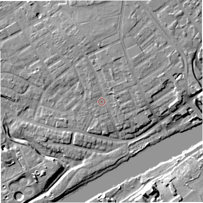 Shaded relief map of the ground around M307AX, computed from Environment Agency LiDAR. The ground here sits at about 23 m above sea level and falls 15 m across the surrounding 800 m. Surface water reaching this point runs off ground lying to the north, 4.4 m higher.