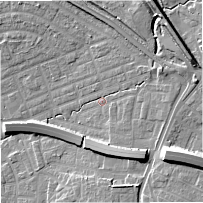 Shaded relief map of the ground around M308AG, computed from Environment Agency LiDAR. The ground here sits at about 23 m above sea level and falls 16 m across the surrounding 800 m. Surface water reaching this point runs off ground lying to the south-east, 2.5 m higher.