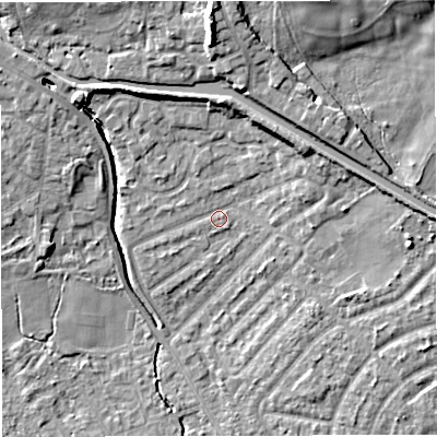 Shaded relief map of the ground around M308JY, computed from Environment Agency LiDAR. The ground here sits at about 22 m above sea level and falls 15 m across the surrounding 800 m. Surface water reaching this point runs off ground lying to the north, 5.8 m higher.